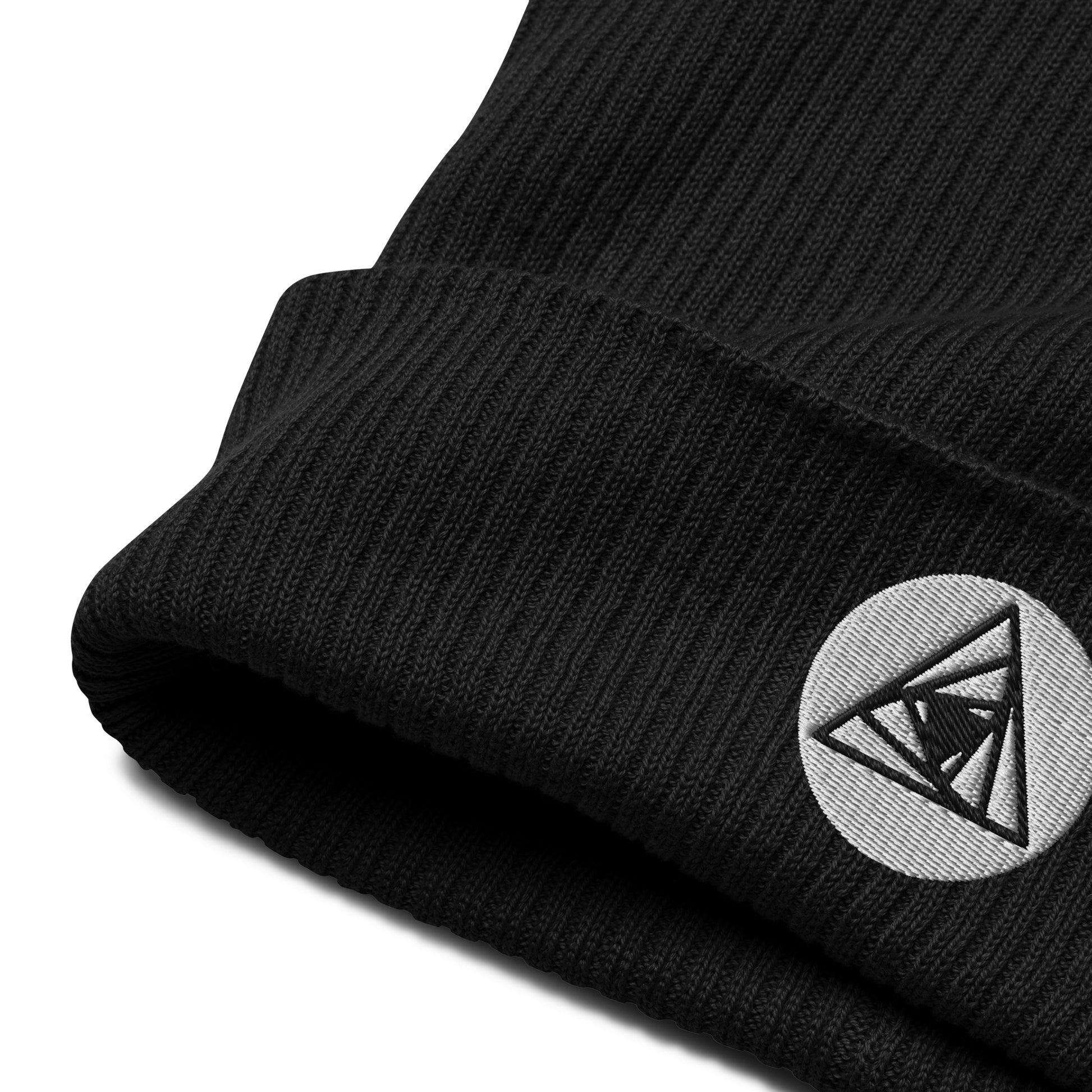 Behold, our Spiraling Equilateral Triangles Beanie in midnight black —a garment of cosmic significance. Crafted from organic cotton and adorned with a mesmerizing Spiraling Equilateral Triangles embroidery, it's not your run-of-the-mill hat. 