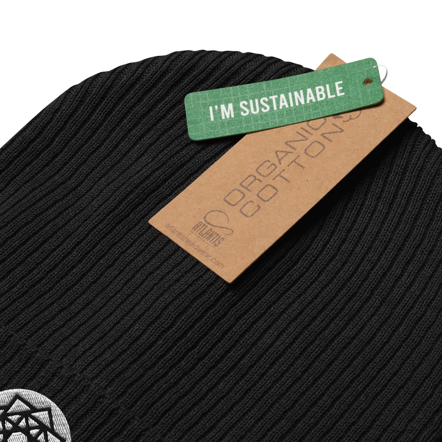 Allow me to introduce our Square Matrix Beanie in Midnight Black, a testament to cosmic order and mathematical elegance. Woven from the finest organic cotton and adorned with the precise geometry of the Square Matrix symbol, this beanie transcends mere headwear with a label of I'M Sustainable